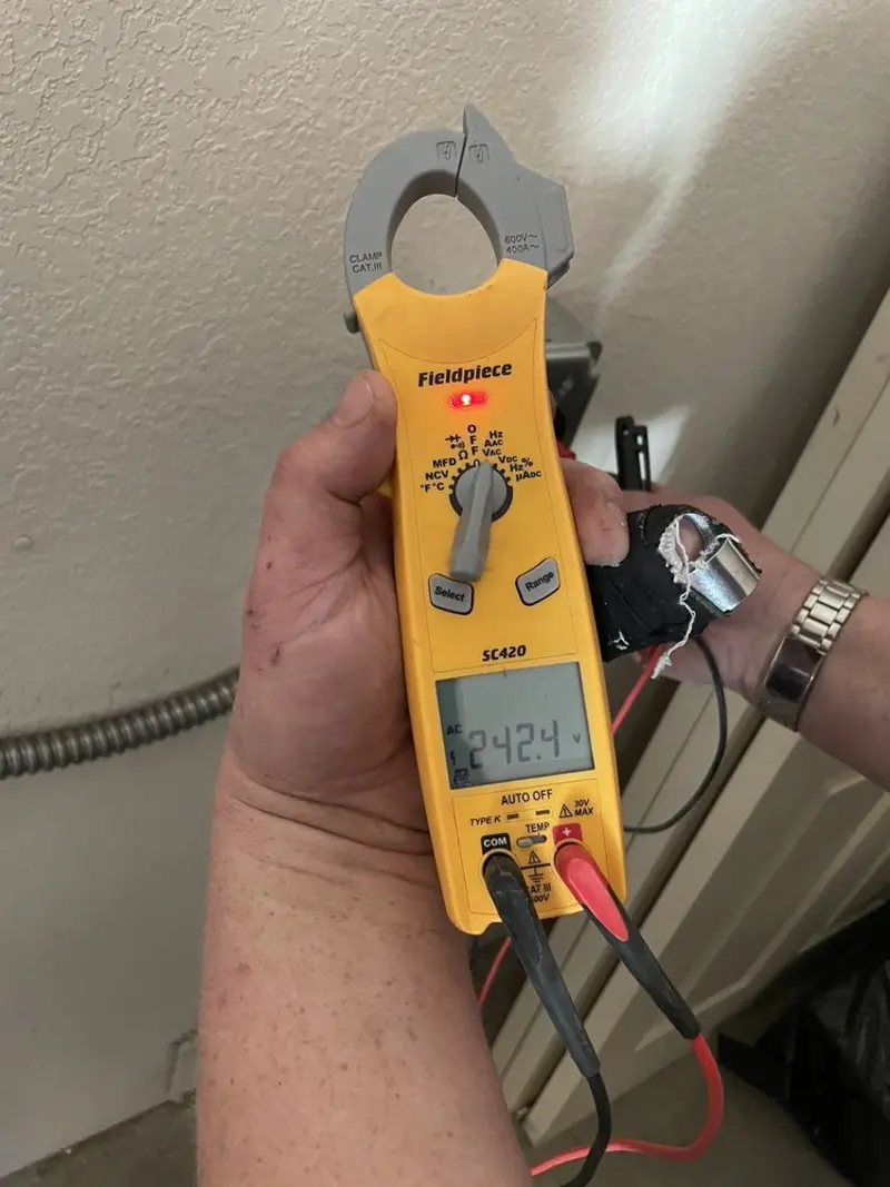 Voltage testing with clamp meter during Generator Installation in Raymond